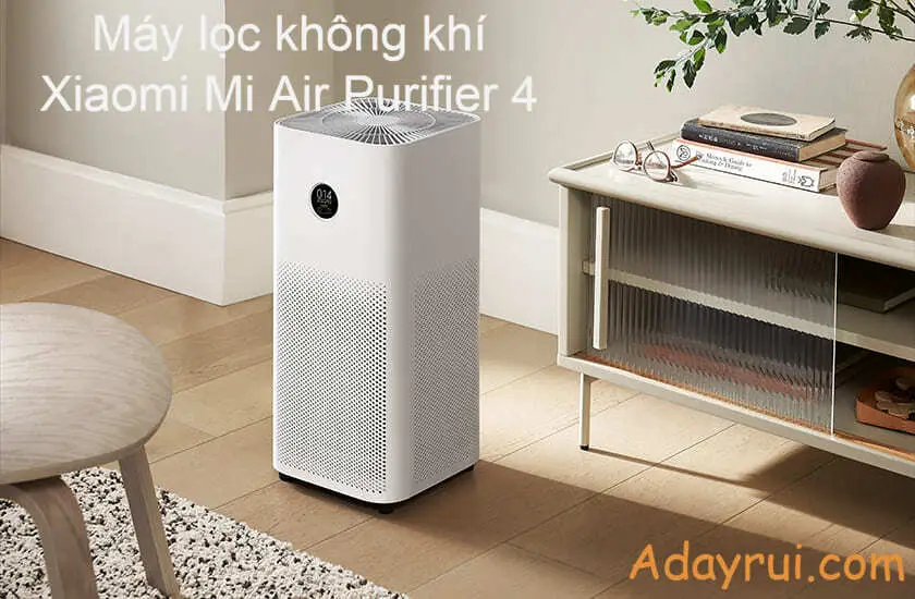 Máy lọc không khí đặt cạnh kệ sách trong phòng khách hiện đại, ánh sáng tự nhiên hài hòa.